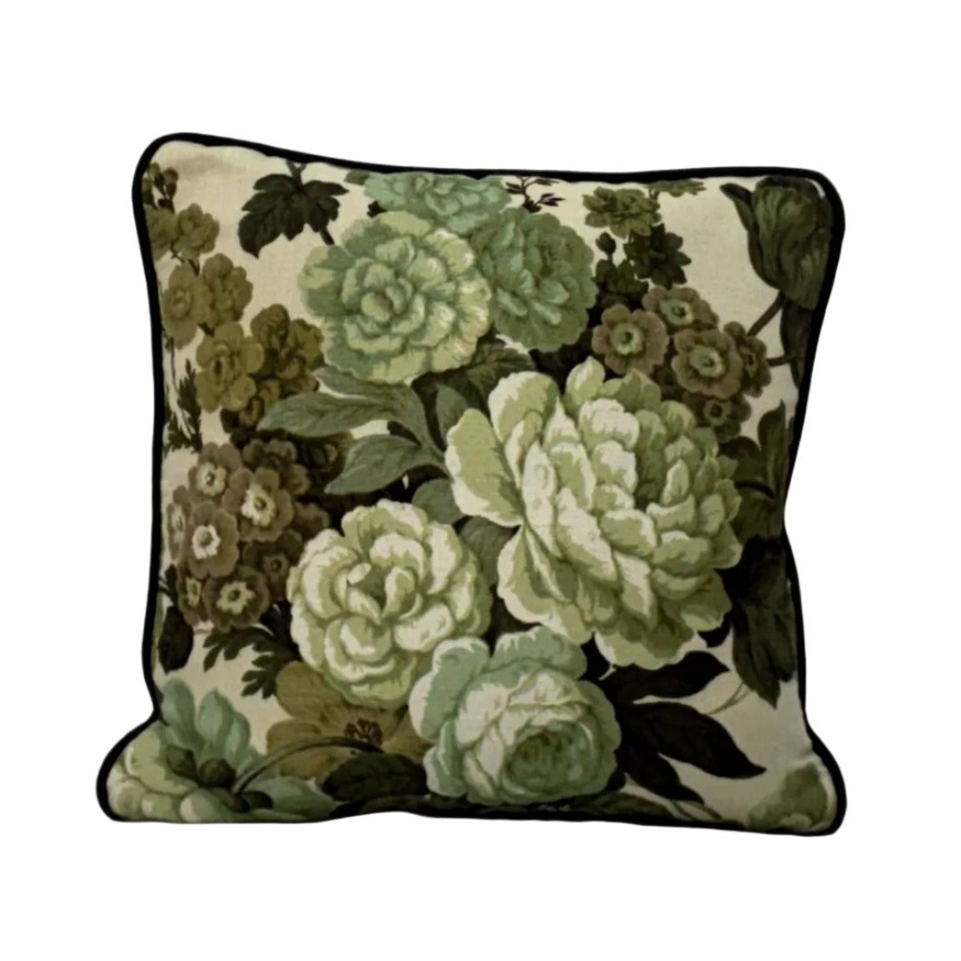 Floral-patterned pillow on a white surface with a neutral background, sea foam back