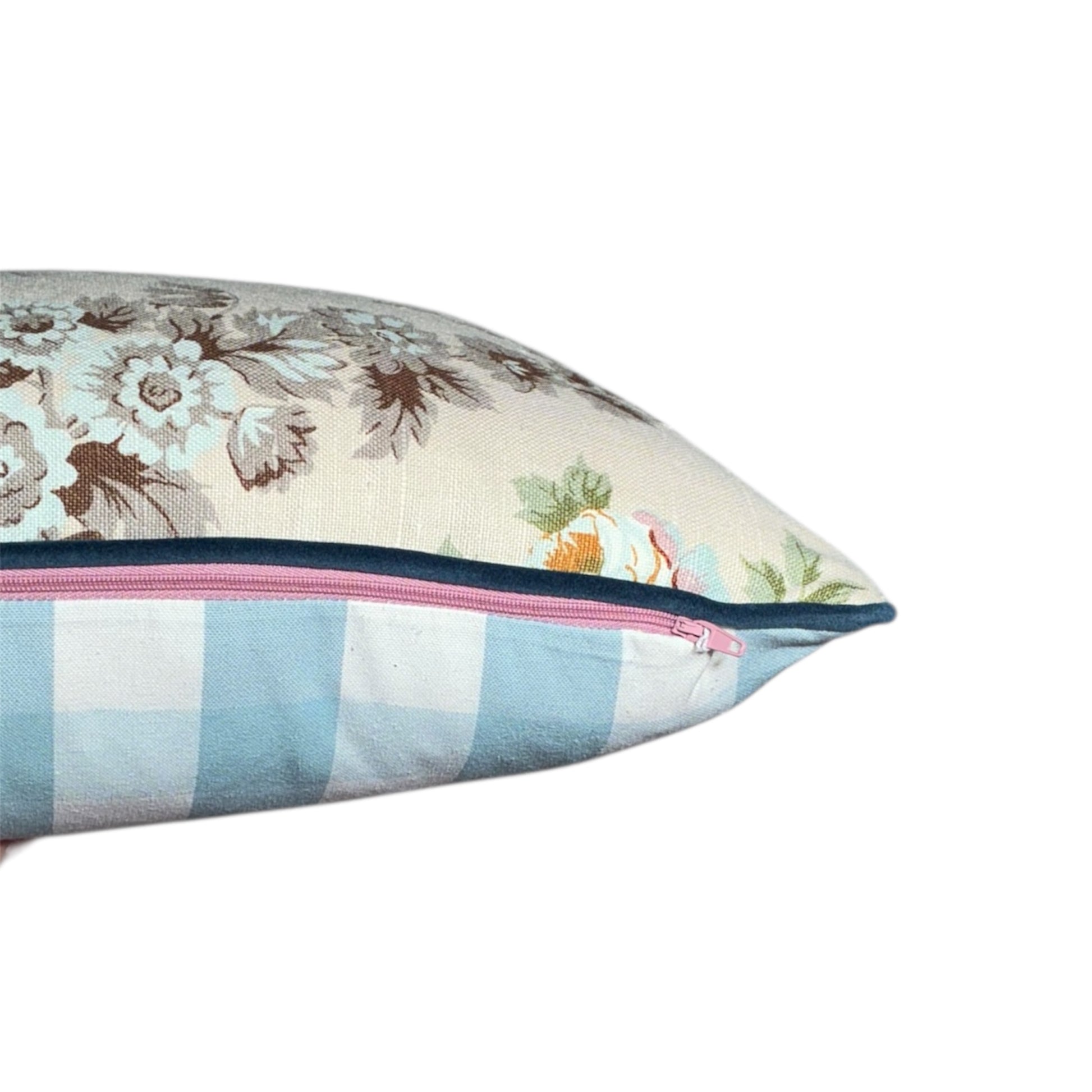 Floral and checkered pillow with a pink zipper and Navy Stripe in lumbar