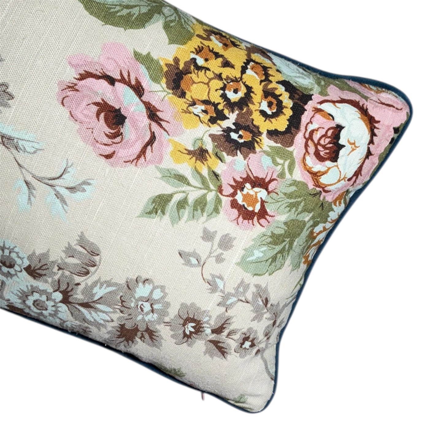 Floral patterned pillow with colorful flowers on a neutral background