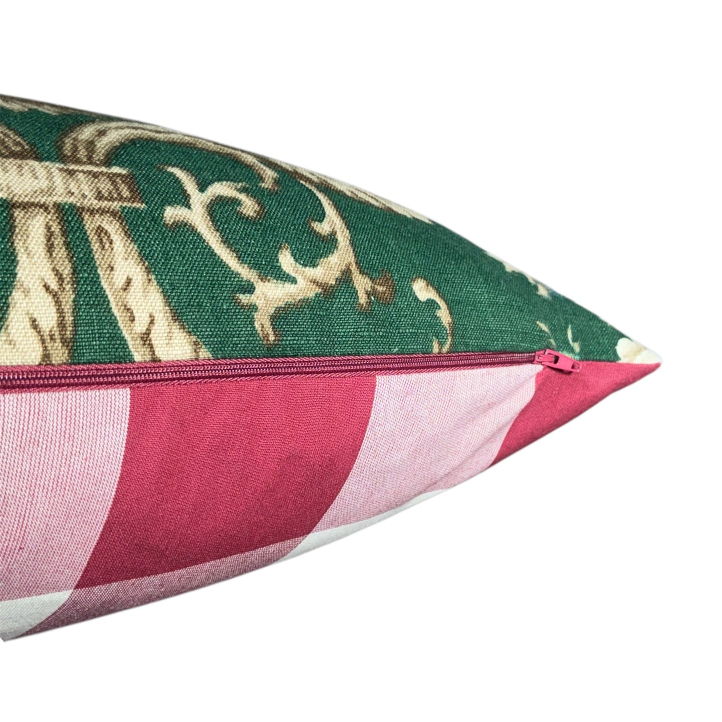 Decorative pillow with green fabric featuring gold patterns and red  with a checked back and red zipper